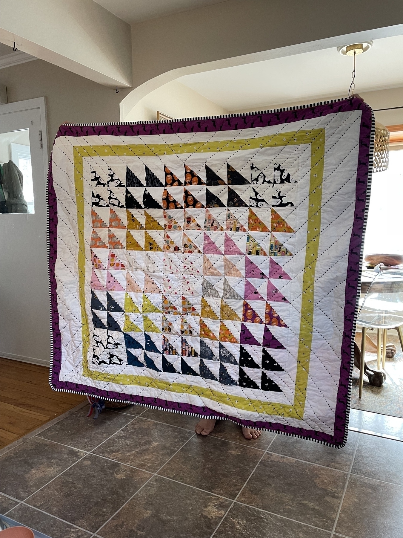 Large quilt made of sashing and half square triangles.